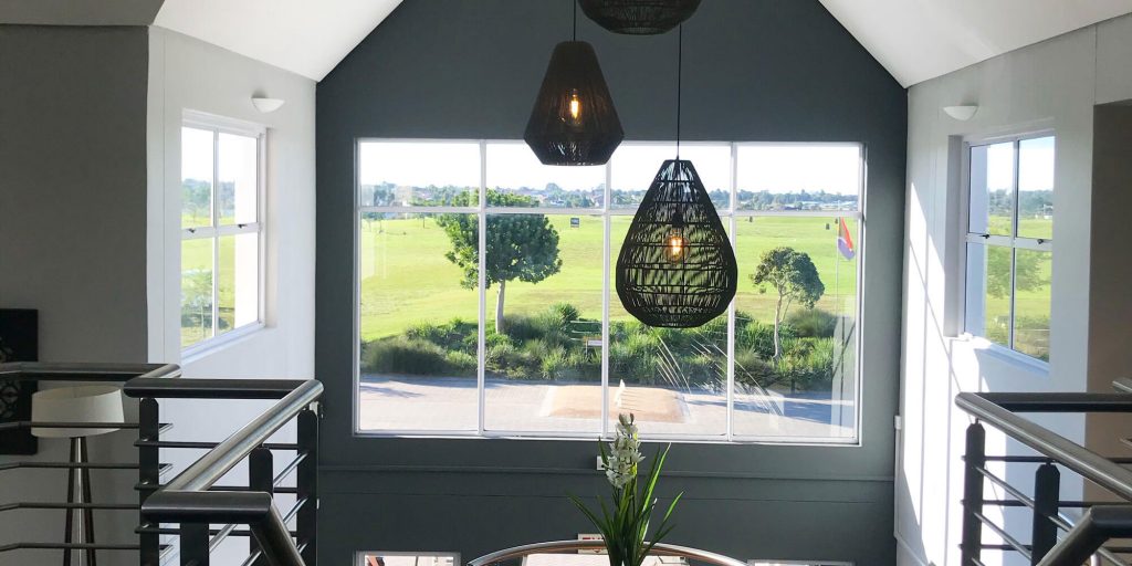 The window that ‘frames the course’, according to interior designer pictured left Idonia Chandler, is one of the most significant and aesthetically pleasing aspects of the refurbished gatehouse.